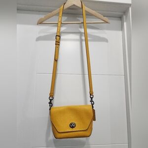 Coach crossbody bag with adjustable strap.  Yellow leather